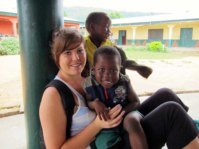 Volunteer with children at an orphanage in Ghana